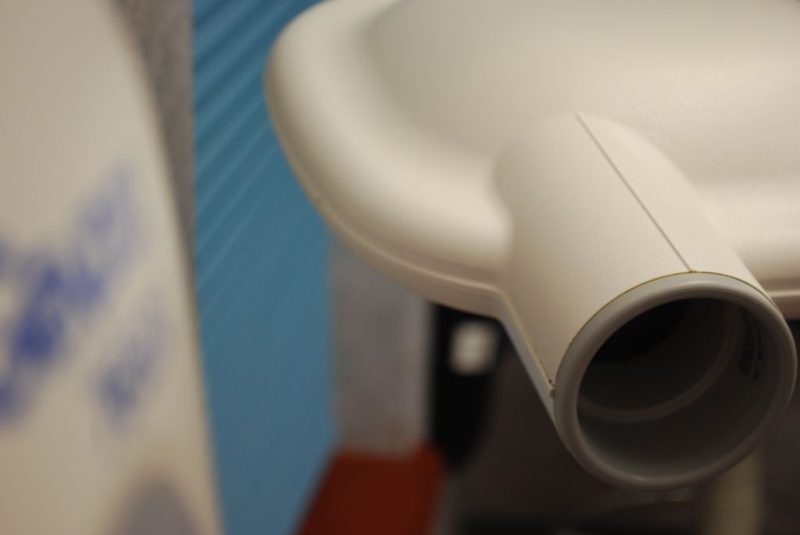 Close-up detail of a dental X-ray machine cone and positioner.